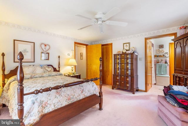 bedroom with light colored carpet, baseboards, and ceiling fan