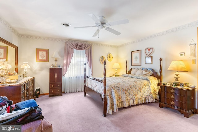 bedroom with carpet flooring, ceiling fan, and visible vents