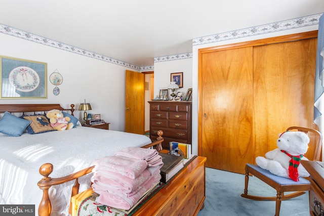 bedroom with a closet and carpet floors