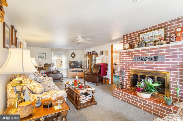 carpeted living room featuring a baseboard heating unit, ceiling fan, and a fireplace