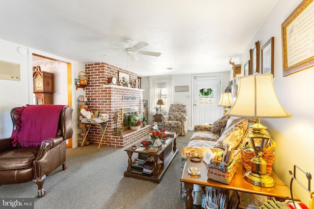 carpeted living room with a ceiling fan and a fireplace