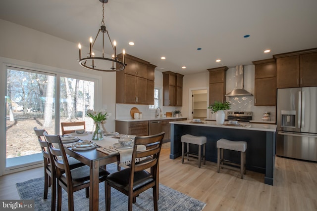 dining room featuring recessed lighting and light wood-style floors