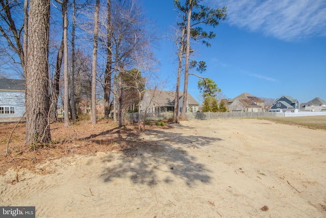 view of front of home featuring fence