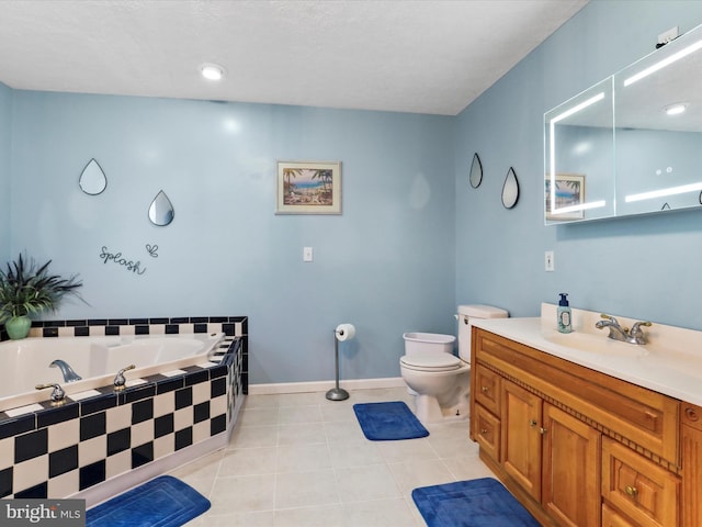 full bath with tile patterned flooring, vanity, toilet, baseboards, and a garden tub