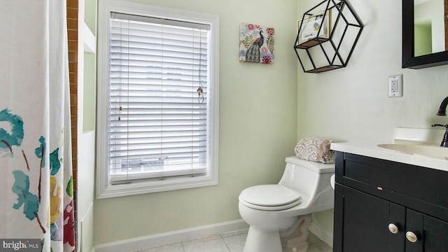 bathroom with toilet, a shower with shower curtain, vanity, baseboards, and tile patterned floors