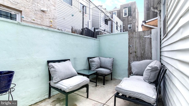 view of patio featuring fence