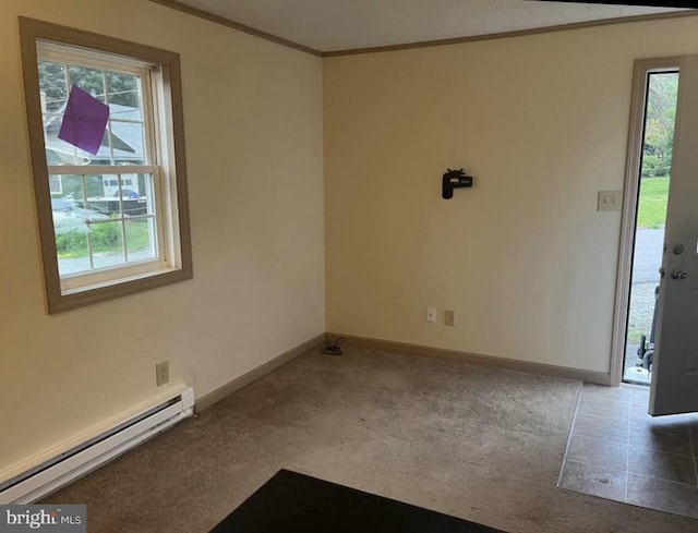 unfurnished room featuring carpet flooring, crown molding, a baseboard heating unit, and baseboards