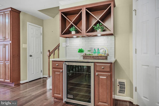 bar featuring tasteful backsplash, visible vents, wine cooler, a dry bar, and dark wood-style floors