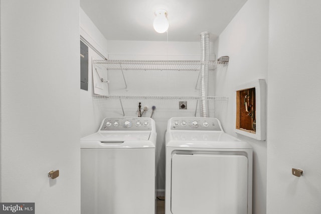 washroom featuring laundry area and washing machine and clothes dryer