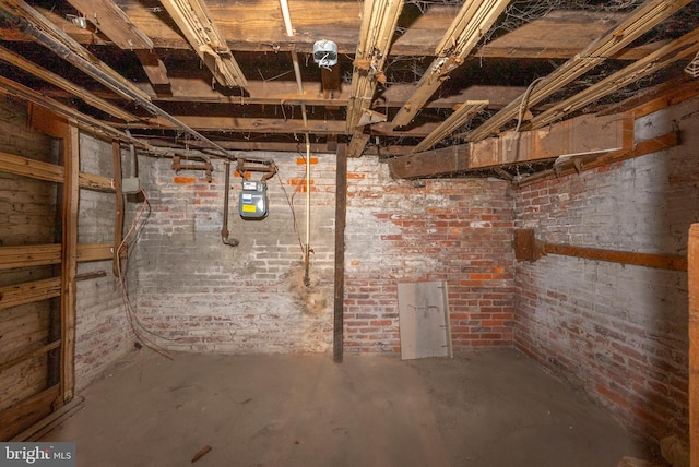 unfinished basement with brick wall