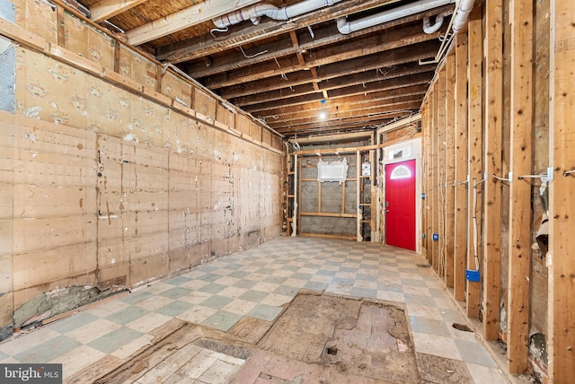 unfinished basement featuring tile patterned floors