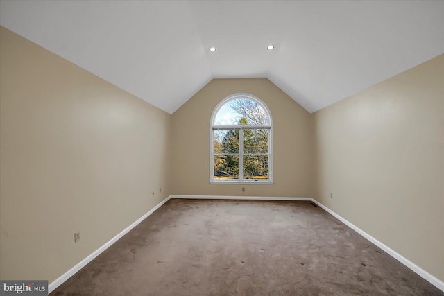 additional living space with carpet, vaulted ceiling, baseboards, and recessed lighting