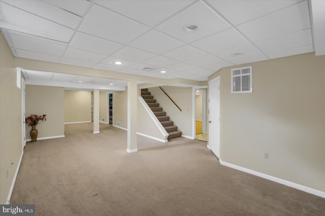 finished below grade area featuring carpet, recessed lighting, visible vents, baseboards, and stairs