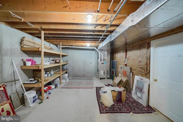 unfinished basement featuring heating unit