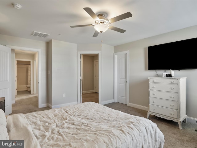 carpeted bedroom featuring visible vents, baseboards, and a ceiling fan