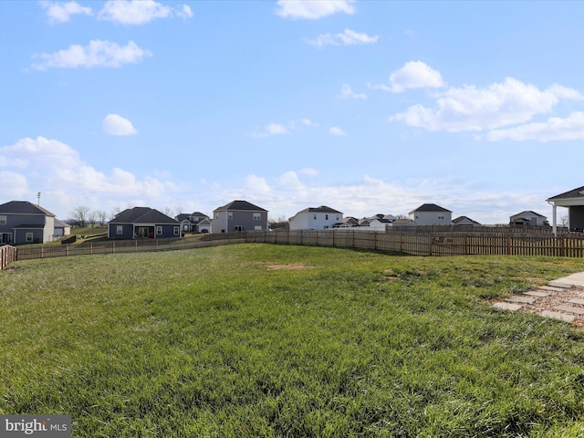 view of yard featuring a residential view and fence