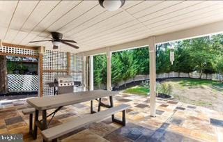 view of patio / terrace featuring outdoor dining area and a ceiling fan