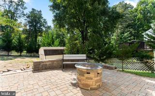 view of patio / terrace with an outdoor fire pit