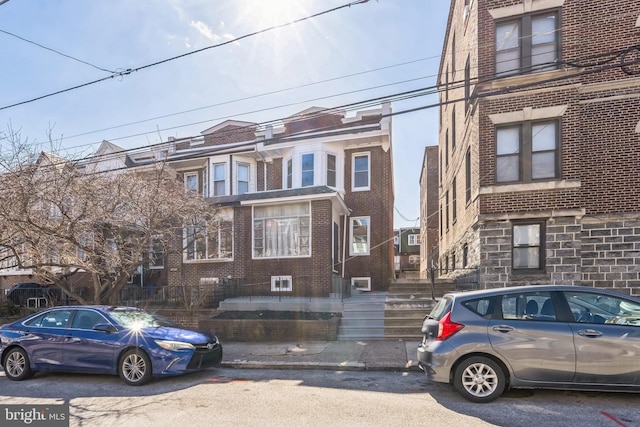 multi unit property featuring brick siding