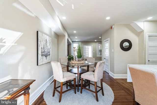 dining space with recessed lighting, dark wood finished floors, and baseboards