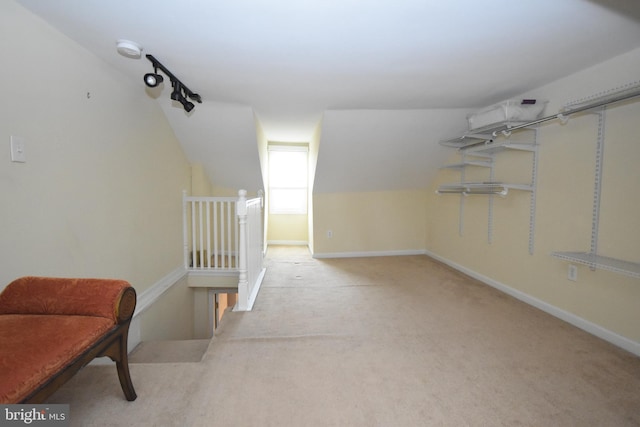 bonus room featuring carpet floors, lofted ceiling, and baseboards