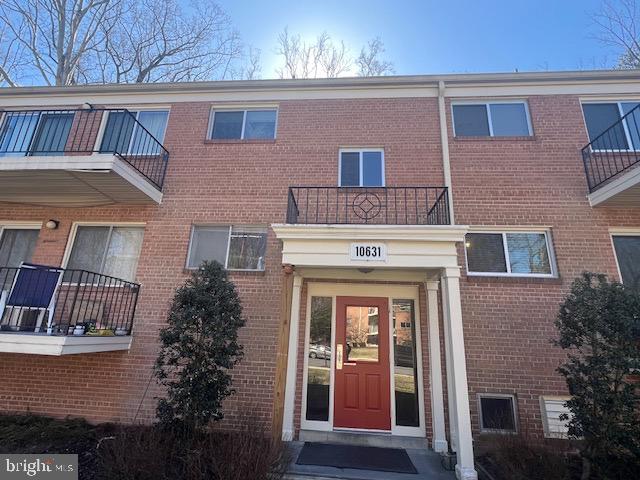 property entrance with brick siding