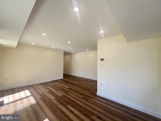 interior space with recessed lighting, wood finished floors, visible vents, and baseboards