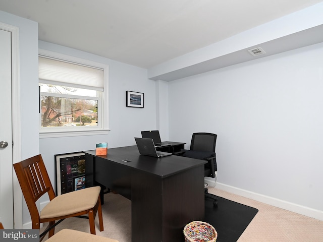 office space featuring carpet, visible vents, and baseboards