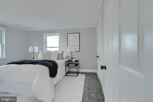 bedroom featuring baseboards and ornamental molding