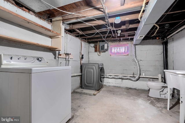 below grade area with washer and dryer and electric panel