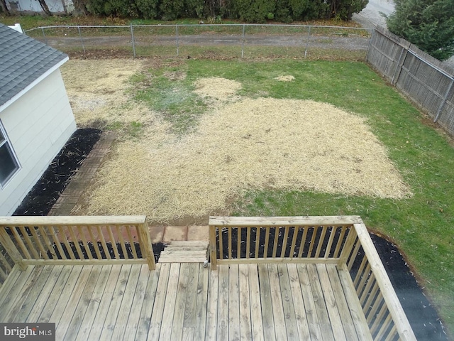 view of yard with fence and a deck