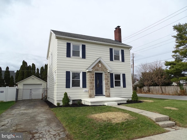 view of front of home with an outbuilding, a chimney, fence, and a garage