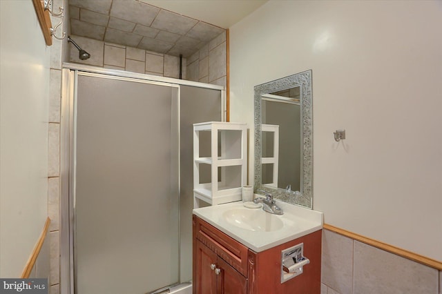 bathroom featuring vanity and a stall shower