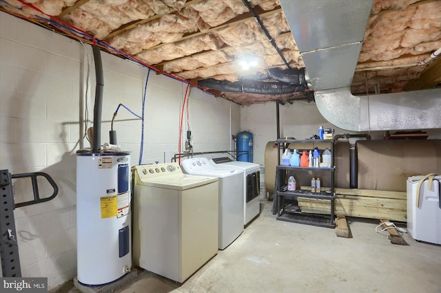 laundry area featuring independent washer and dryer, water heater, and laundry area