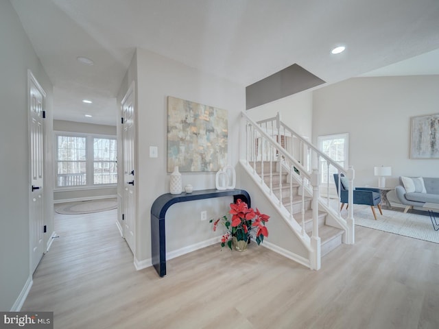 interior space with a wealth of natural light, wood finished floors, and recessed lighting