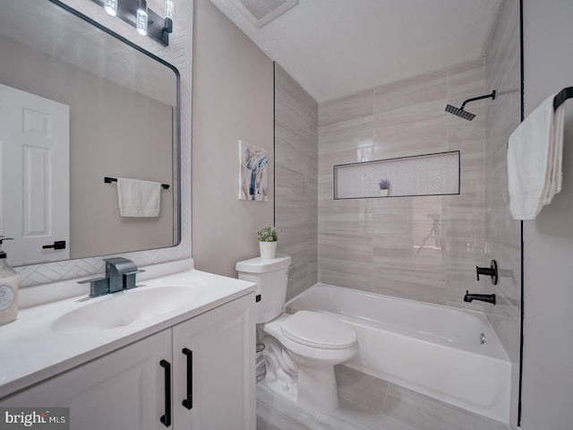 bathroom featuring visible vents, tub / shower combination, toilet, and vanity