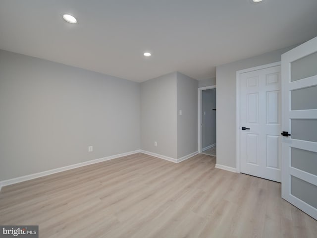 unfurnished bedroom with recessed lighting, baseboards, and light wood finished floors