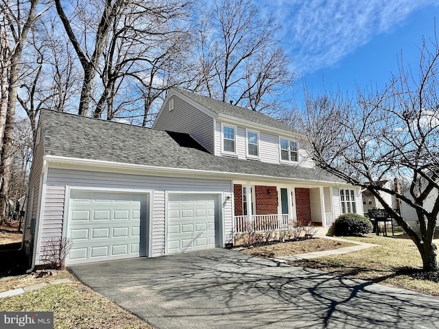 view of front of home featuring aphalt driveway, covered porch, an attached garage, and a shingled roof