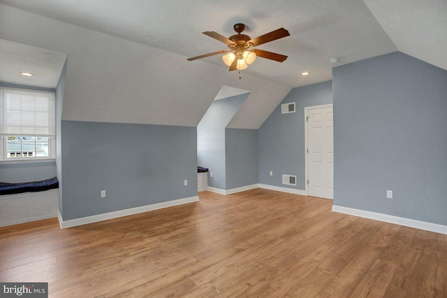 bonus room featuring visible vents, baseboards, and wood finished floors