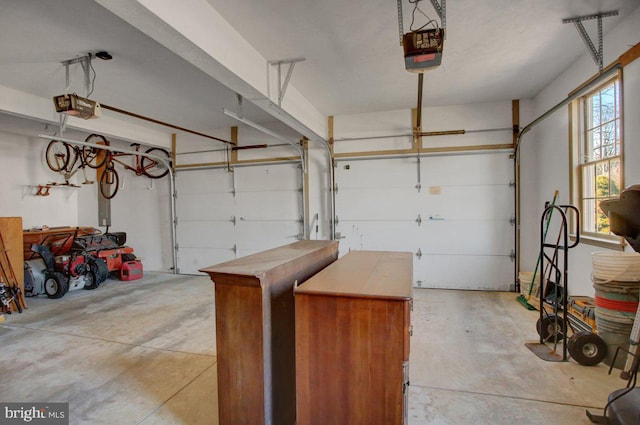 garage featuring a garage door opener