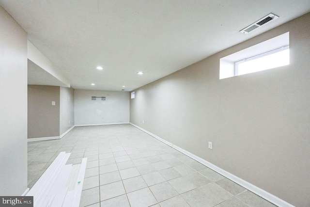 below grade area with recessed lighting, baseboards, and visible vents