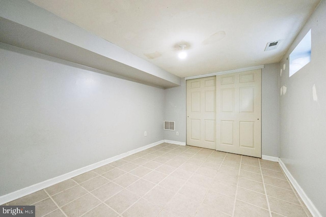 interior space featuring visible vents, baseboards, and light tile patterned flooring