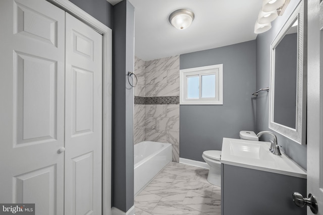 bathroom with toilet, vanity, baseboards, marble finish floor, and a closet