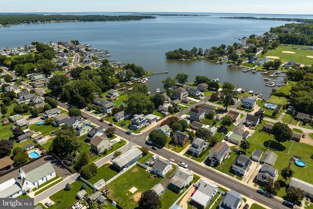 birds eye view of property featuring a residential view and a water view