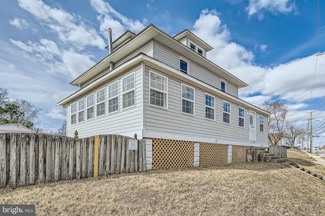 view of property exterior with fence