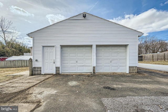 garage with fence