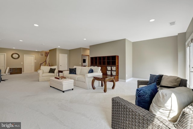 living room with recessed lighting, baseboards, carpet, and stairs