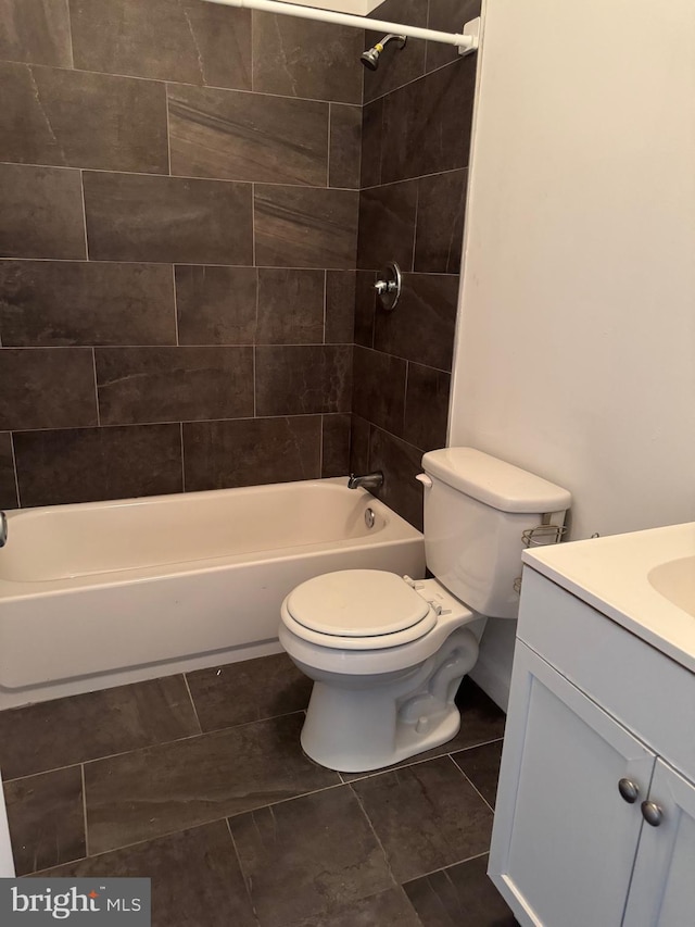 bathroom with shower / tub combination, vanity, and toilet