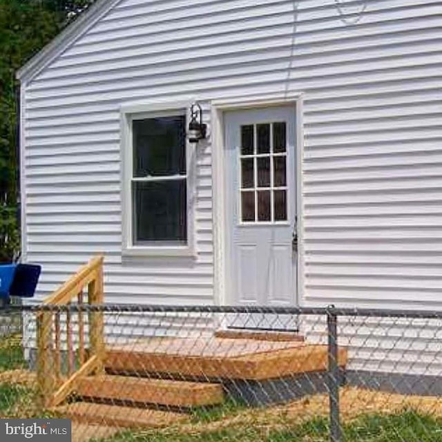 doorway to property with a deck