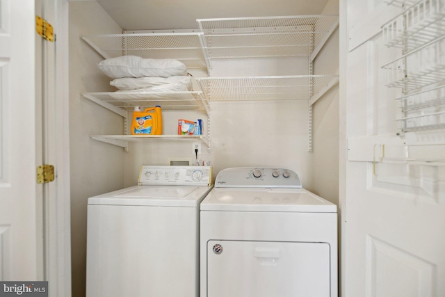 laundry area featuring washing machine and dryer and laundry area